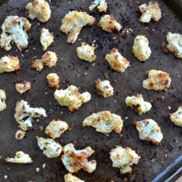 a baking pan with baked cauliflower florets