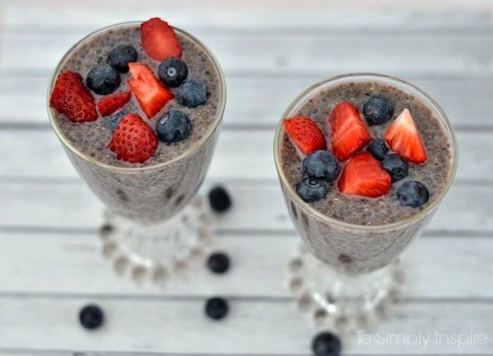A close up of Chia Seed Pudding topped strawberries and blueberries 