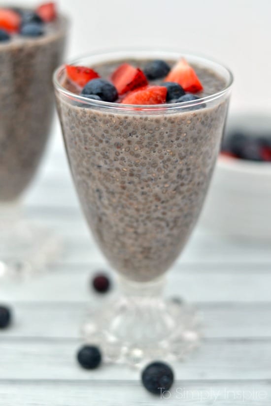A close up of Chia Seed Pudding topped strawberries and blueberries 