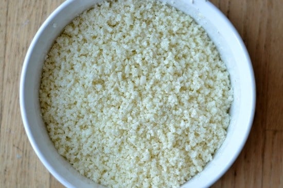 Cauliflower riced in a white bowl