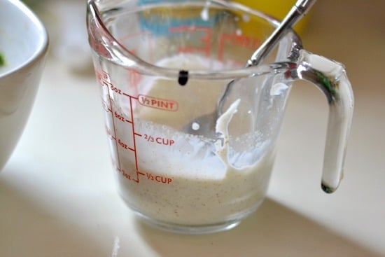 Cucumber Avocado Salsa sauce in a glass measuring cup