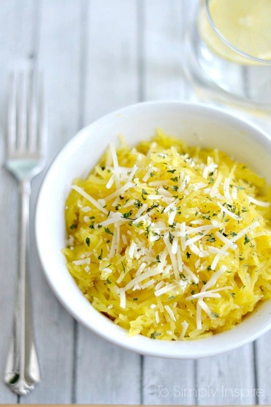 spaghetti squash topped with parmesan cheese in a white bowl