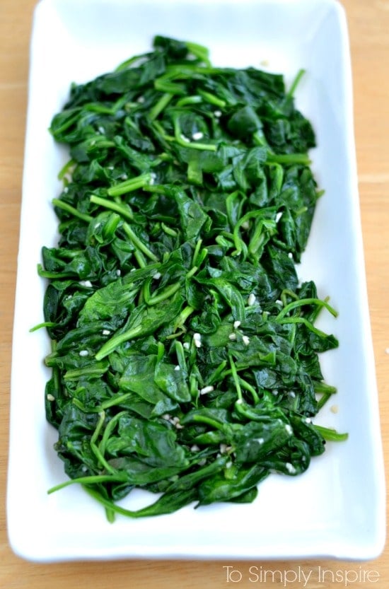 Sauteed Spinach with garlic on a white plate