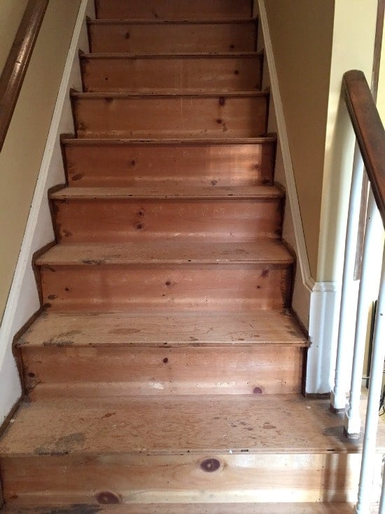 A wood staircase with no stain 
