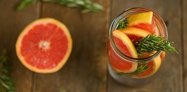 A glass of orange slices in a glass