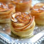 close-up of Apple Rose Puffed Pastries recipe on a silver platter.