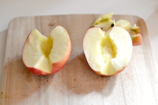 Cut and cored apples on a cutting board 