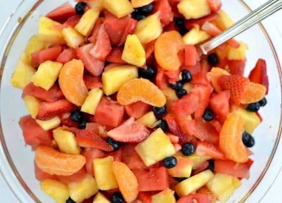 Closeup of Fruit Salad with Honey Lime Dressing recipe in a big glass bowl