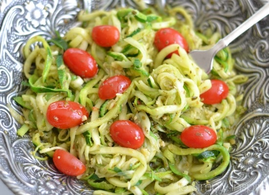 Pesto Zucchini Noodles with a fork in a big silver bowl 