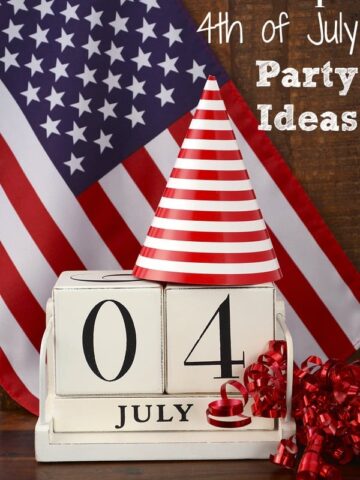cream wooden blocks with the number 04 and July underneath with an American flag in background