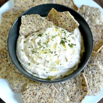 White Bean Dip Recipe in a bowl surrounded by chips with text overlay