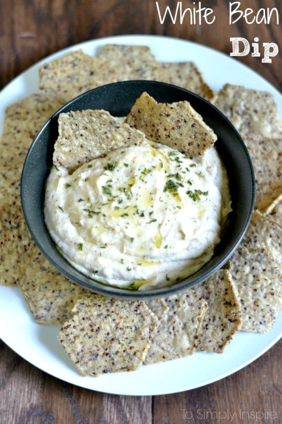 White Bean Dip Recipe in a bowl surrounded by chips with text overlay 