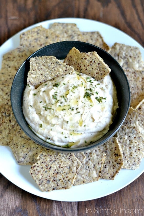 White Bean Dip Recipe on a plate surrounded by chips