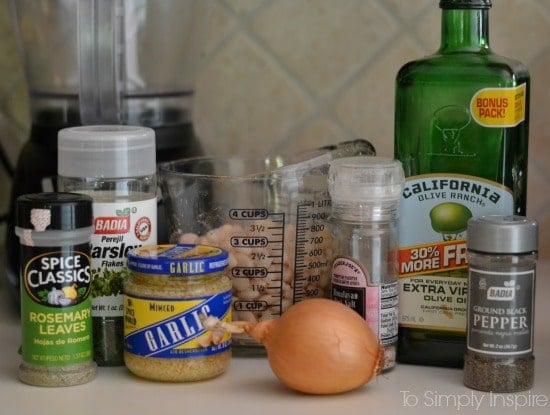 White Bean Dip Ingredients on a counter - eggs, garlic, olive oil bottle, 