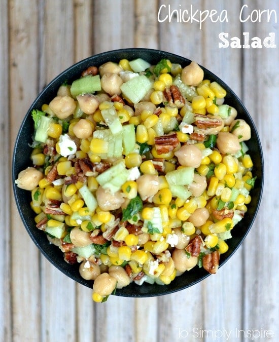 bowl full of chickpeas, corn, cucumber slices and pecans