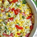 orzo pasta salad with sliced cherry tomatoes and corn