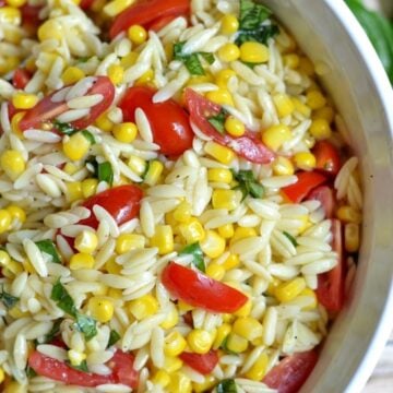 orzo pasta salad with sliced cherry tomatoes and corn