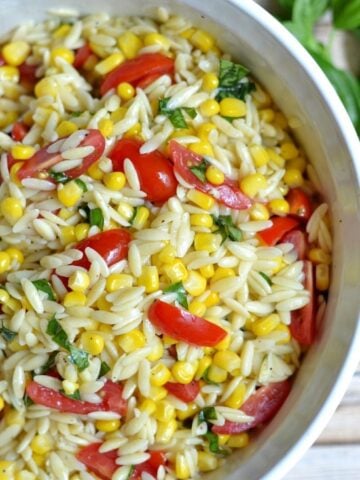 orzo pasta salad with sliced cherry tomatoes and corn