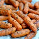 A pile of cooked baby carrots