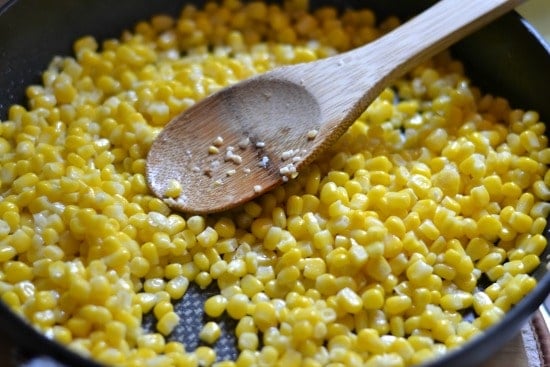 roasting corn kernels in a pan