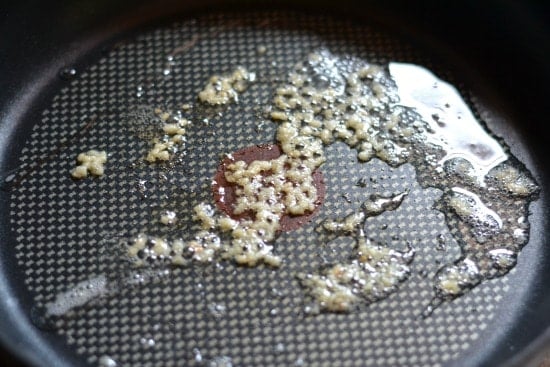 sauteing garlic in a pan