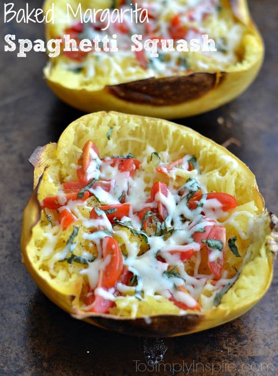 spaghetti squash half with tomatoes, fresh basil and cheese