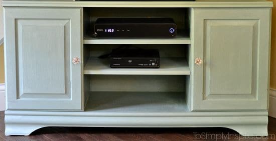 a light green painted tv stand