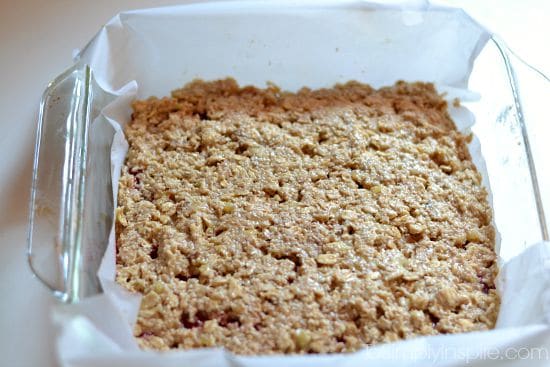 strawberry oatmeal banana bars batter spread in a square baking dish