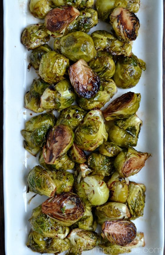 Balsamic Brussel Sprouts recipe on a rectangle white plate.