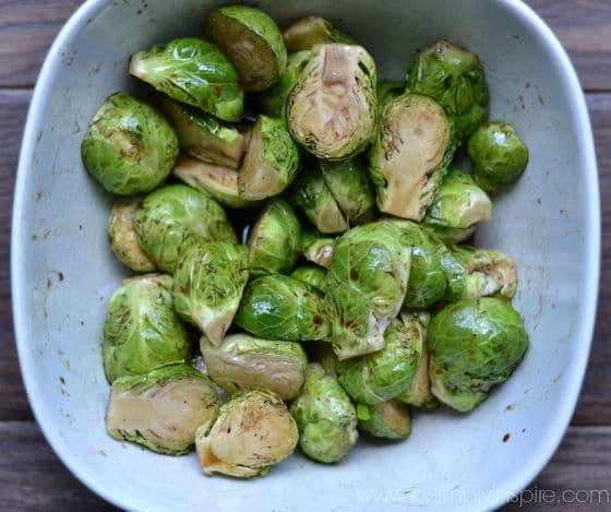 sliced uncooked Brussel Sprouts tossed in balsamic vinegar