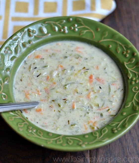 zucchini soup recipe in a green bowl with a spoon