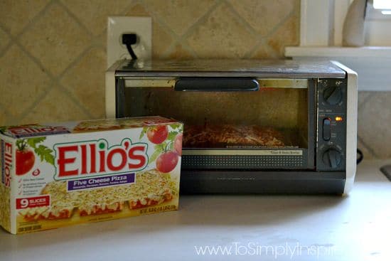 a toaster oven with pizza inside