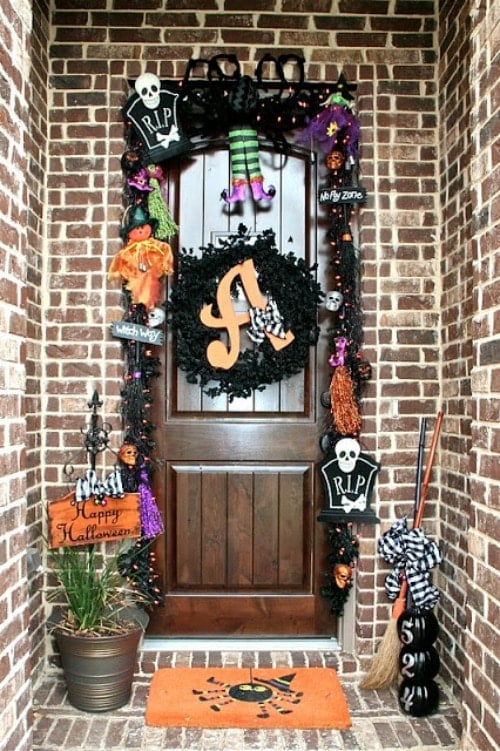 wood front door decorated with an halloween wreath