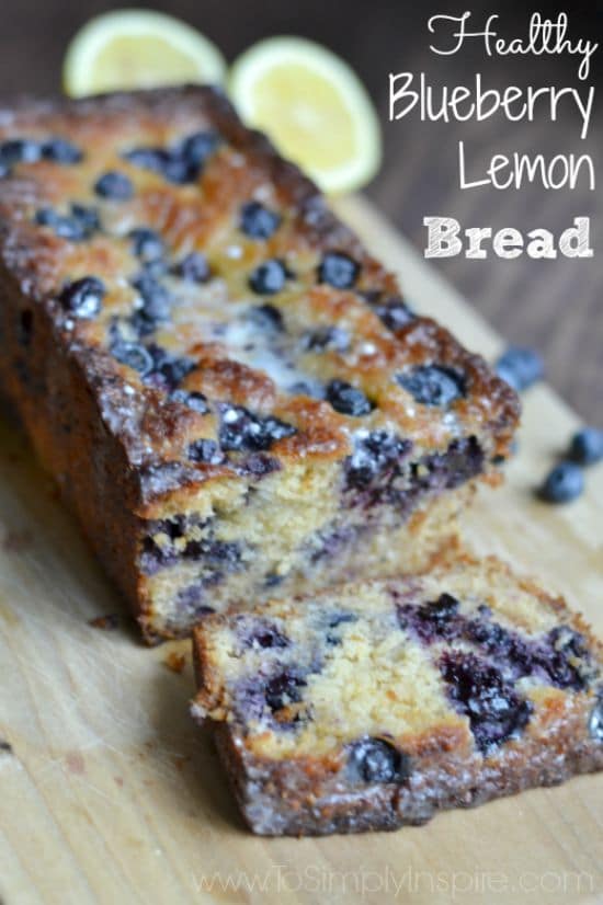 A close up of a piece of blueberry bread on a cutting board with text overlay