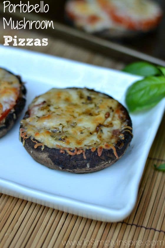 a white plate with a large portobello mushroom topped with cheese