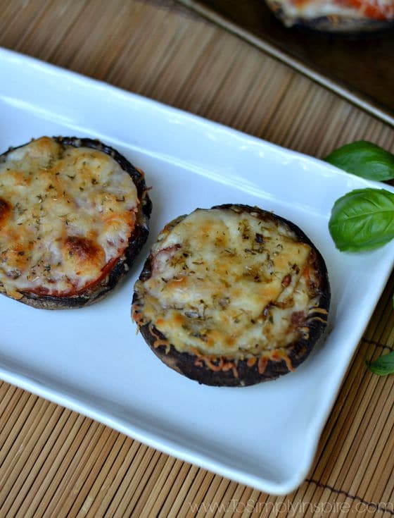 two portobello mushrooms topped with cheese