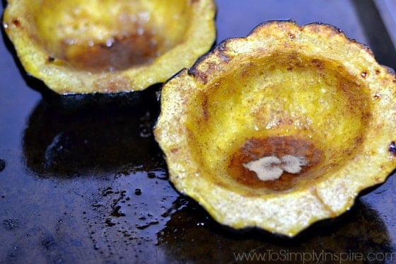 A close up of acorn squash with brown sugar
