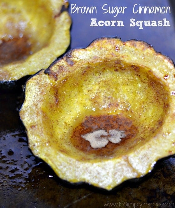 closeup of Baked Brown Sugar Cinnamon Acorn Squash halves on a baking sheet