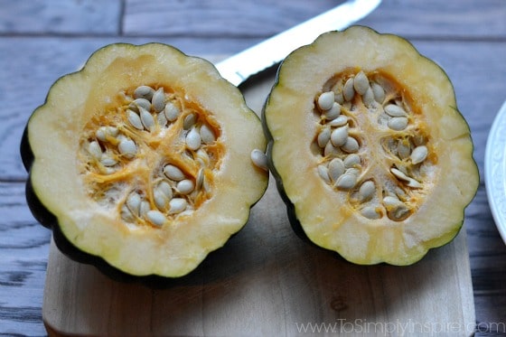 Acorn Squash cut in half on a cutting board