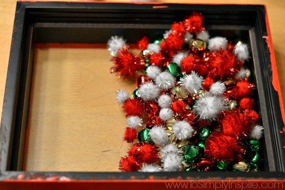 A close up of red and white pom poms in a box