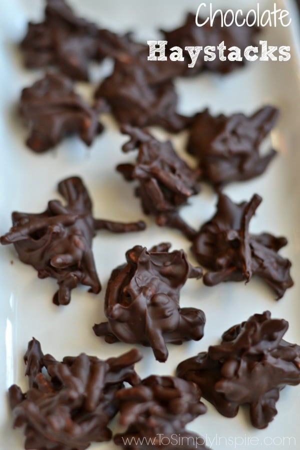 These easy no-bake Chocolate Haystacks are chocolatey crunchiness made with 2 simple ingredients! Haystacks Recipe on a white plate