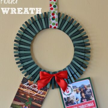 a wreath made out of painted green clothespins