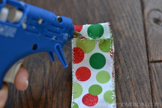 a polka dot piece of ribbon with red and green dots 