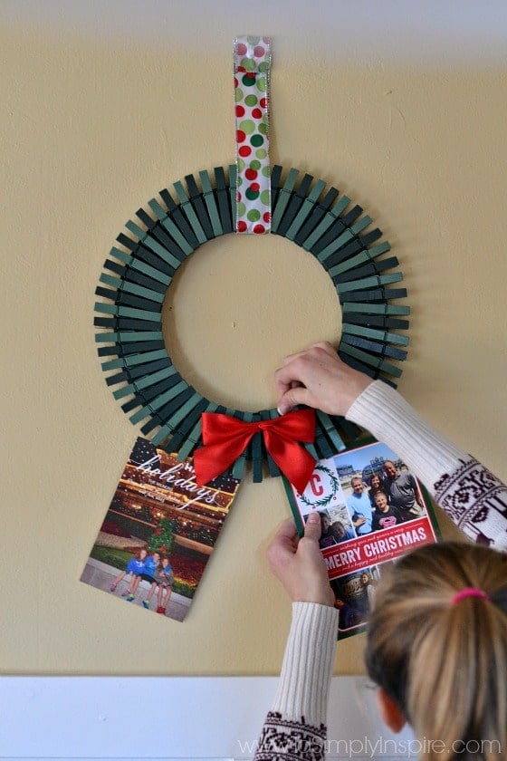 a wreath made out of painted green clothespins