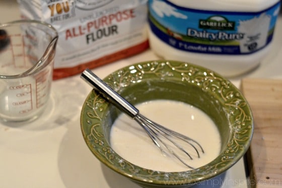 a green bowl with milk