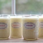 four homemade soy candles in mason jars