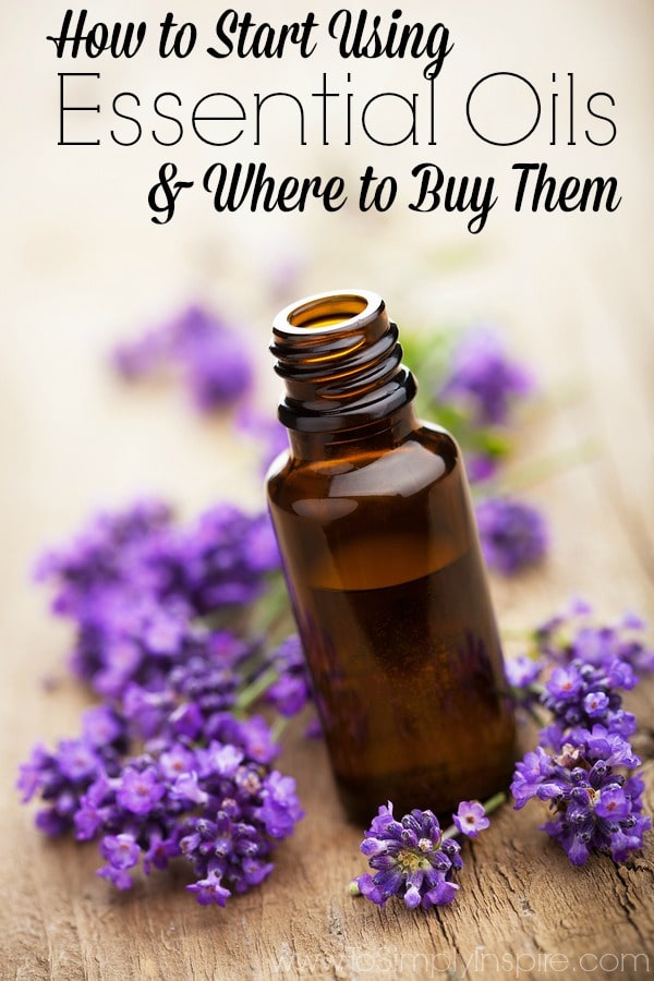 A close up of a small brown bottle surrounded by lavender flowers