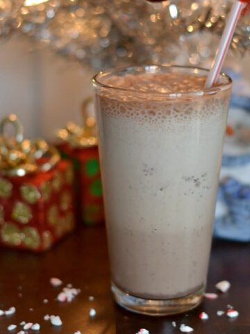a glass of peppermint mocha smoothie with a straw
