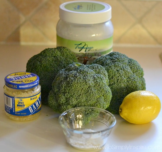 broccoli, garlic, lemon, coconut oil on a counter