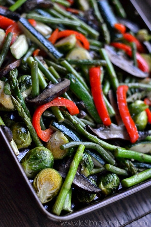 a baking sheet with a variety of roasted vegetables
